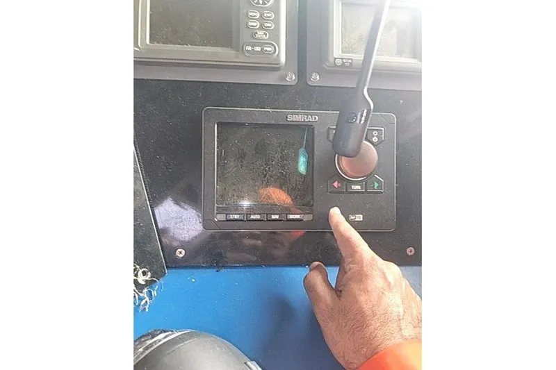  Yacht Photos Pics Control panel of 2016 Mützelfeldtwerft Offshore Fast Crew Taxi Catamaran with hand operating Simrad display.