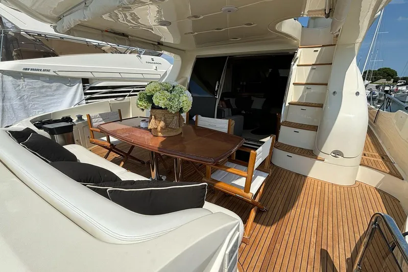  Yacht Photos Pics Luxurious 2008 Azimut Fly 68 yacht deck with elegant seating and dining area.