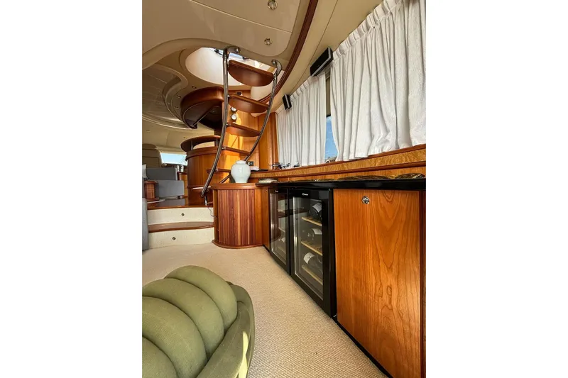  Yacht Photos Pics Luxurious interior of 2008 Azimut Fly 68 yacht with elegant wood finishes and modern amenities.