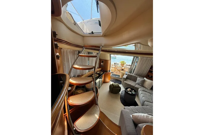  Yacht Photos Pics Luxurious interior of 2008 Azimut Fly 68 yacht with elegant staircase and comfortable seating.