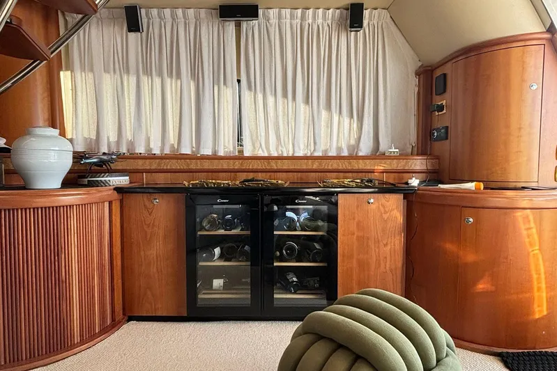  Yacht Photos Pics Luxurious interior of 2008 Azimut Fly 68 yacht with wooden cabinetry and wine cooler.