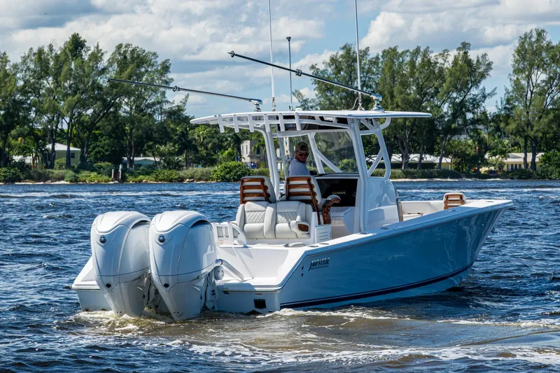  Yacht Photos Pics 2022 Jupiter 32 boat cruising on a sunny day with twin engines.