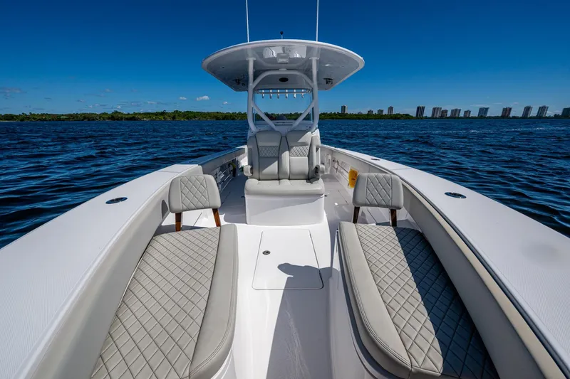  Yacht Photos Pics 2022 Jupiter 32 boat on water, featuring luxurious seating and clear blue skies.