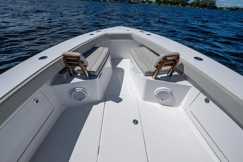  Yacht Photos Pics Bow seating area of 2022 Jupiter 32 boat on water.