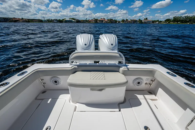  Yacht Photos Pics 2022 Jupiter 32 boat with dual engines on a sunny day, open water view.