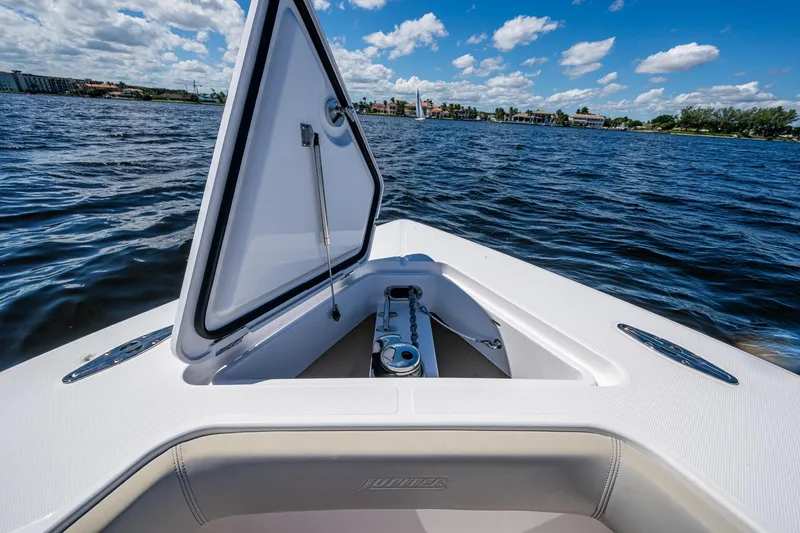  Yacht Photos Pics Open hatch on 2022 Jupiter 32 boat, overlooking calm waters and blue sky.