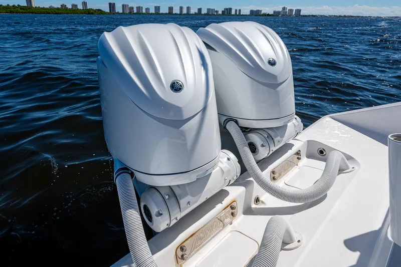  Yacht Photos Pics Twin outboard engines on a 2022 Jupiter 32 boat, cruising on open water.