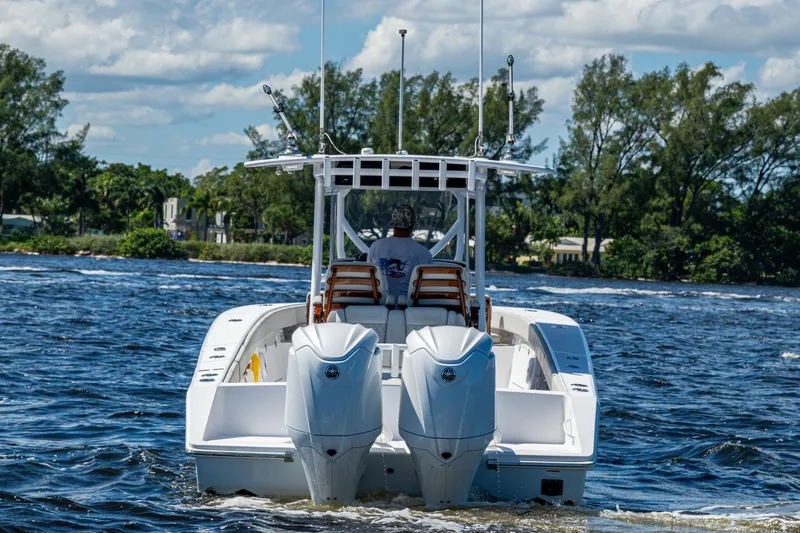  Yacht Photos Pics 2022 Jupiter 32 boat cruising on a sunny day with twin engines.