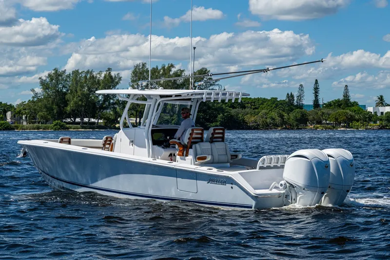  Yacht Photos Pics 2022 Jupiter 32 boat cruising on a sunny day with twin engines.