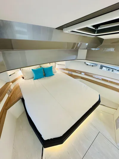  Yacht Photos Pics Luxurious interior of 2024 Rio Yachts Daytona 50 with modern bedding and ambient lighting.