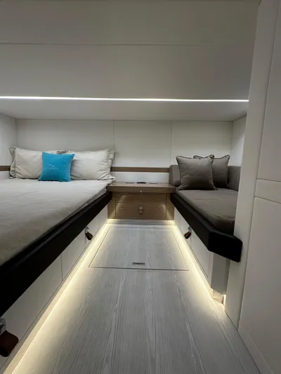  Yacht Photos Pics 2024 Rio Yachts Daytona 50 cabin interior with modern twin beds and ambient lighting.