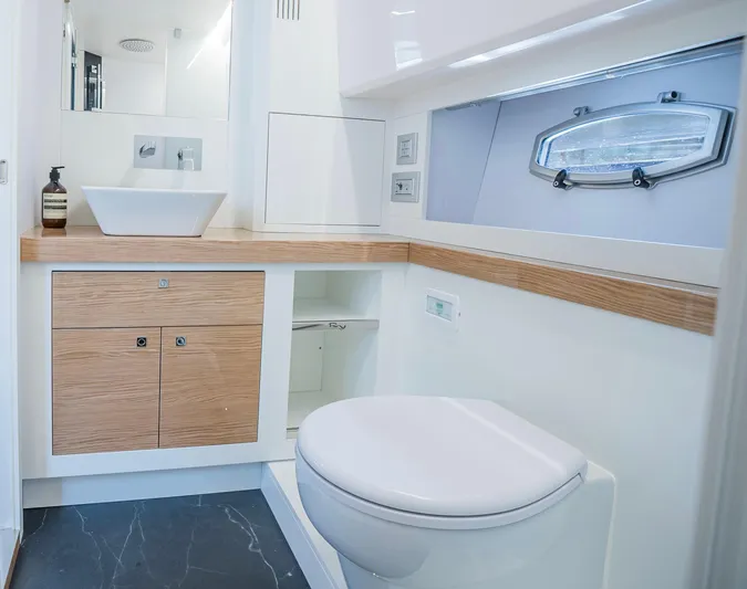  Yacht Photos Pics Luxurious bathroom in 2024 Rio Yachts Daytona 50, featuring modern fixtures and elegant design.