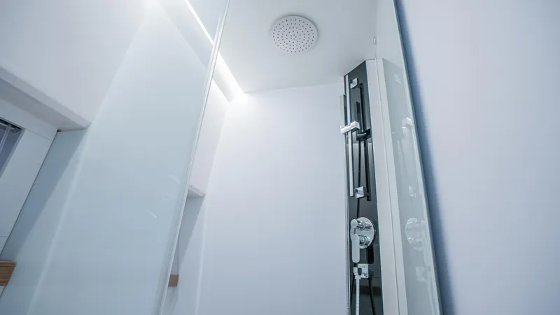  Yacht Photos Pics Modern shower in 2024 Rio Yachts Daytona 50, featuring sleek design and luxury fixtures.