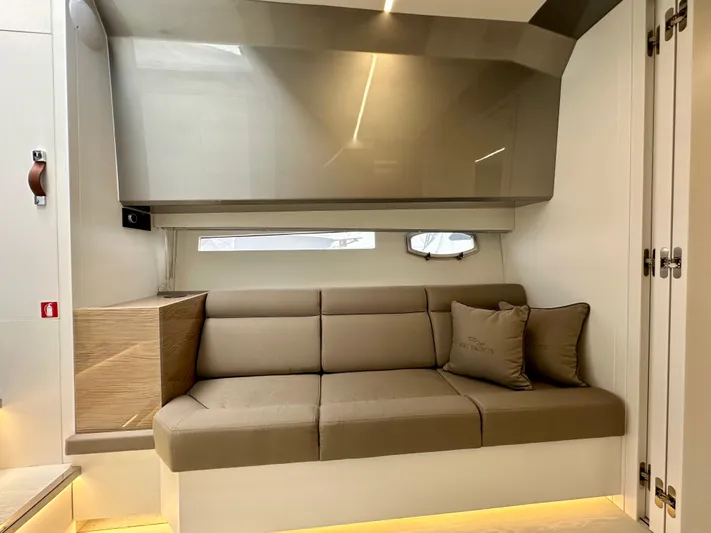  Yacht Photos Pics Luxurious interior of 2024 Rio Yachts Daytona 50 with modern beige sofa and sleek design.