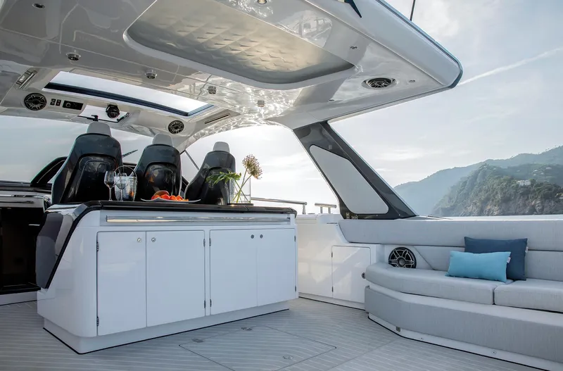  Yacht Photos Pics Luxurious 2025 Azimut Verve 48 yacht interior with sleek design and coastal view.