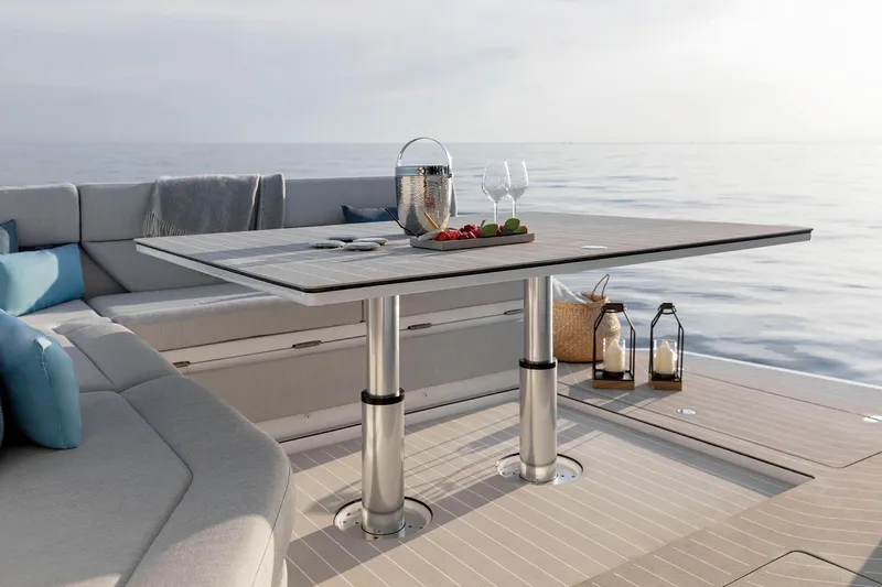  Yacht Photos Pics Luxurious Azimut Verve 48 yacht deck with elegant table setting, ocean view, 2025 model.