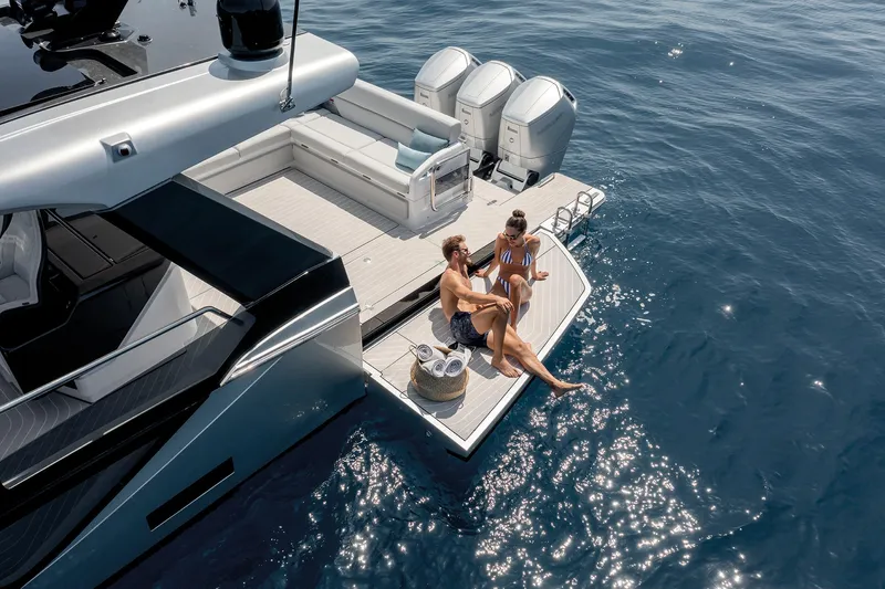  Yacht Photos Pics Couple relaxing on Azimut Verve 48 yacht, 2025 model, enjoying sunny day on the water.