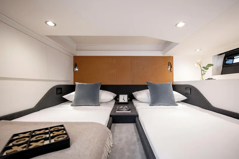  Yacht Photos Pics Luxurious cabin interior of 2025 Azimut Verve 48 yacht with twin beds and modern decor.