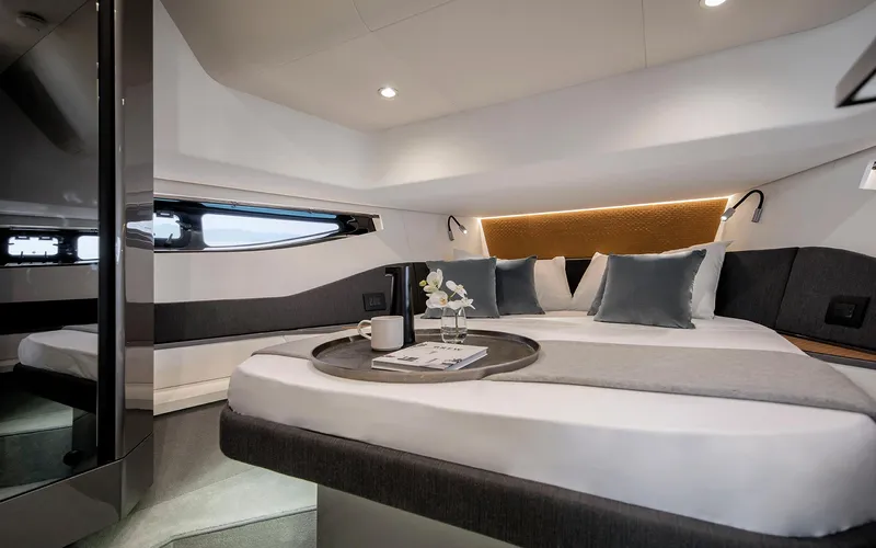  Yacht Photos Pics Luxurious interior of 2025 Azimut Verve 48 yacht with elegant bedding and modern design.