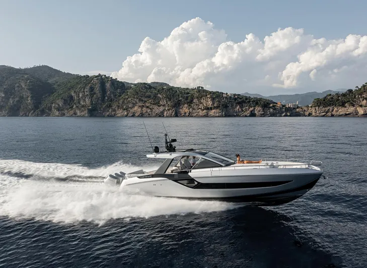  Yacht Photos Pics 2025 Azimut Verve 48 yacht cruising on open water with scenic coastal backdrop.