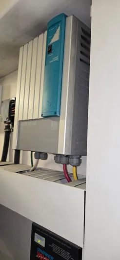 Bouki Yacht Photos Pics Electrical equipment in a 2006 Bertram 670 boat, featuring wiring and control panel.