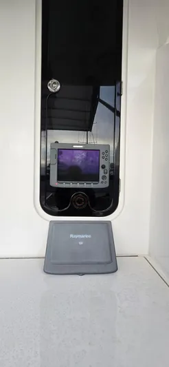 Bouki Yacht Photos Pics Raymarine navigation system on 2006 Bertram 670 yacht dashboard.