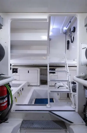 Bouki Yacht Photos Pics Interior of 2006 Bertram 670 yacht, featuring stairs and storage compartments.