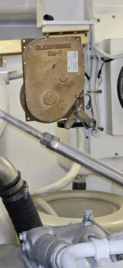 Bouki Yacht Photos Pics Engine room of 2006 Bertram 670 yacht, showcasing mechanical components and piping.