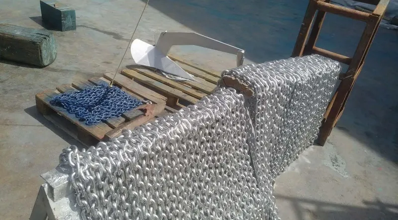 Bouki Yacht Photos Pics Anchor and chains on a Bertram 670 boat deck, 2006 model.