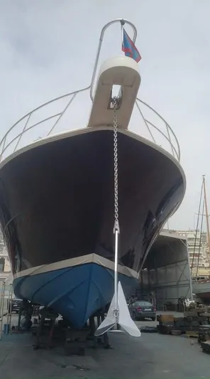 Bouki Yacht Photos Pics Bertram 670 yacht, 2006 model, docked with anchor, viewed from the front.