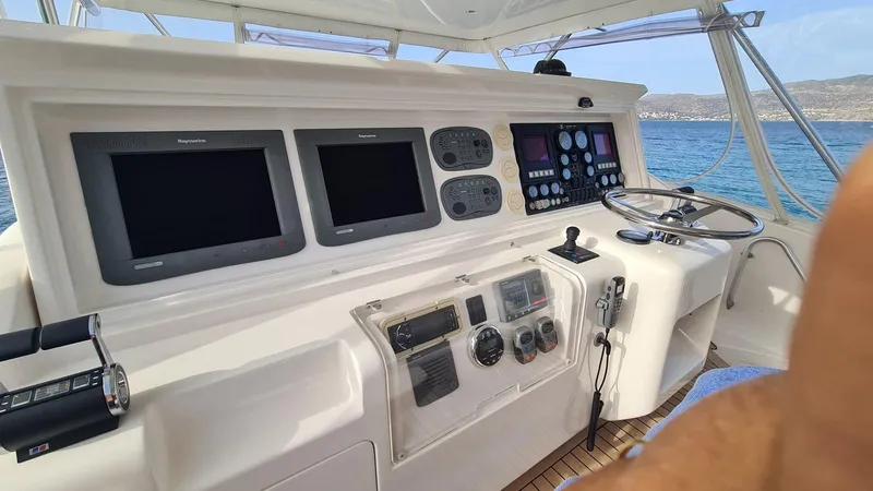 Bouki Yacht Photos Pics Bertram 670 yacht helm, 2006 model, featuring advanced navigation and control systems.