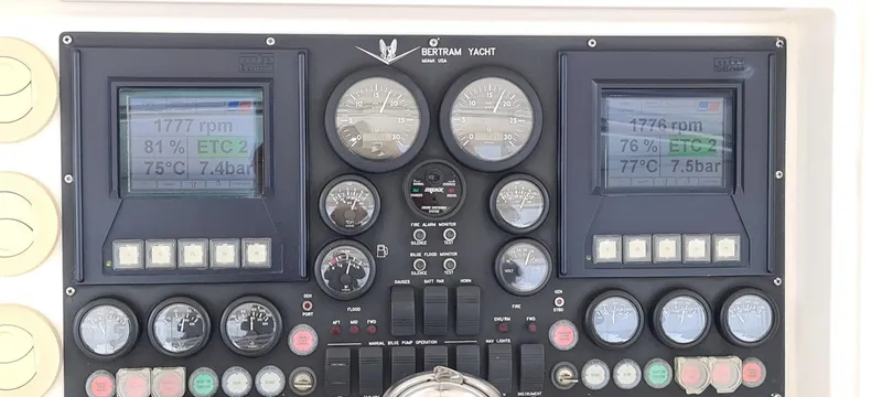 Bouki Yacht Photos Pics Control panel of a 2006 Bertram 670 yacht with gauges and digital displays.