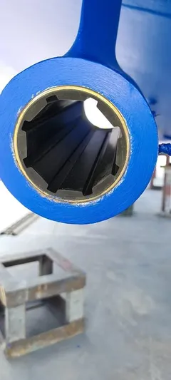 Bouki Yacht Photos Pics Close-up of a blue Bertram 670 boat component, 2006 model, in a workshop setting.