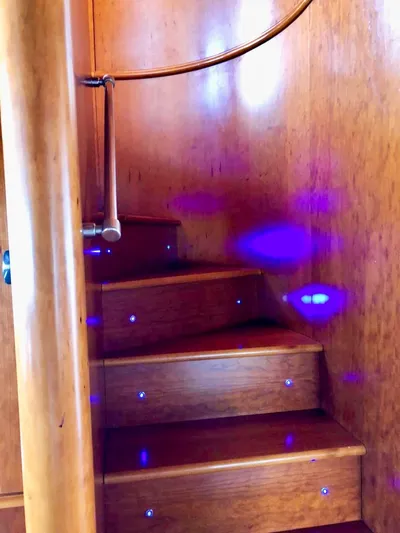 Annamia Yacht Photos Pics Wooden staircase with blue LED lights on a 2007 Terranova Yachts T85.
