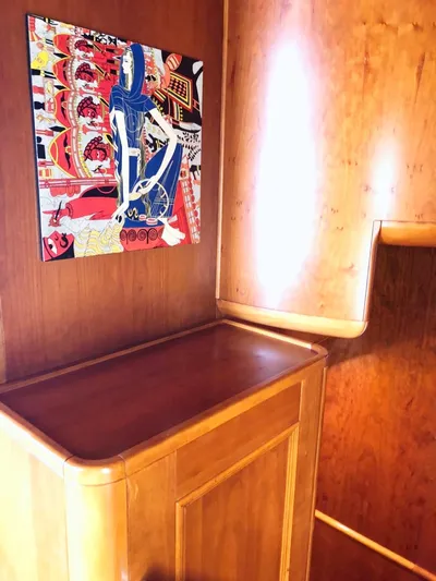 Annamia Yacht Photos Pics Wooden interior of 2007 Terranova Yachts T85 with colorful wall art.