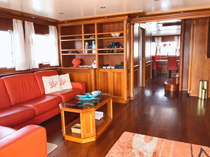 Annamia Yacht Photos Pics Luxurious 2007 Terranova Yachts T85 interior with elegant wood finishes and red leather seating.