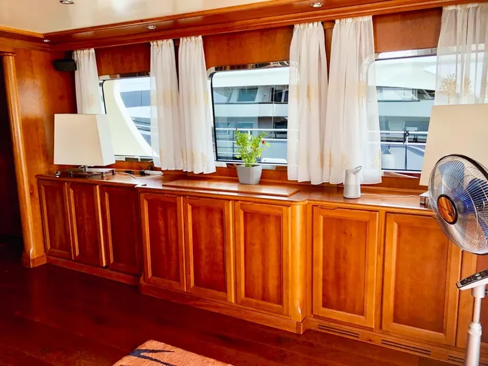 Annamia Yacht Photos Pics Luxurious interior of 2007 Terranova Yachts T85 with wooden cabinetry and elegant decor.