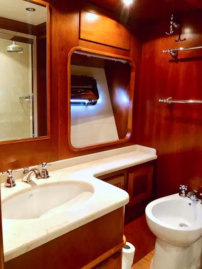 Annamia Yacht Photos Pics Luxurious 2007 Terranova Yachts T85 bathroom with elegant wood finish and modern fixtures.