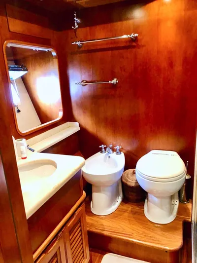 Annamia Yacht Photos Pics Luxurious 2007 Terranova Yachts T85 bathroom with wooden finish and modern fixtures.