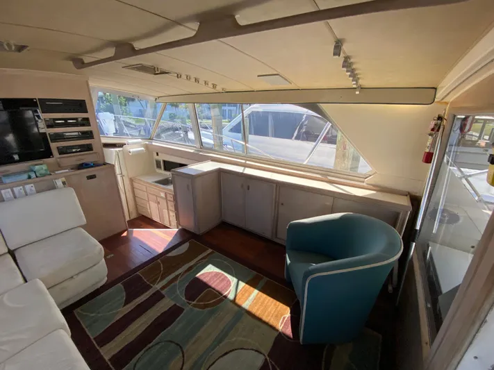  Yacht Photos Pics Interior of 1982 Bertram 46.6 War Wagon yacht with modern seating and cabinetry.