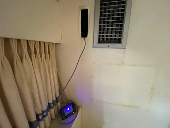  Yacht Photos Pics Interior of 1982 Bertram 46.6 War Wagon with curtain, vent, and electronic device.