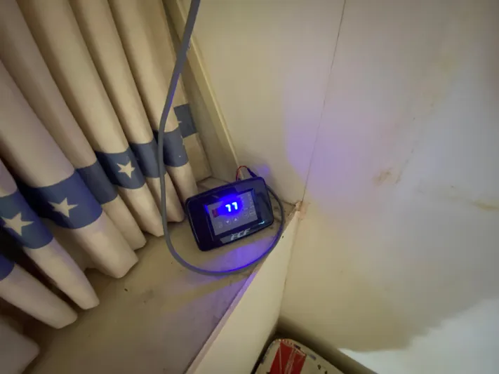  Yacht Photos Pics Digital display on Bertram 46.6 War Wagon, 1982, near star-patterned curtains.