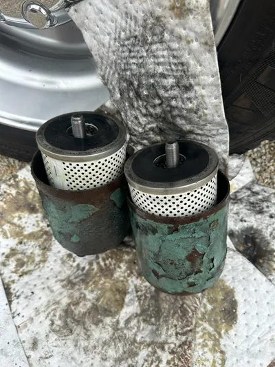  Yacht Photos Pics Rusty filters from a 1982 Bertram 46.6 War Wagon on a stained cloth.