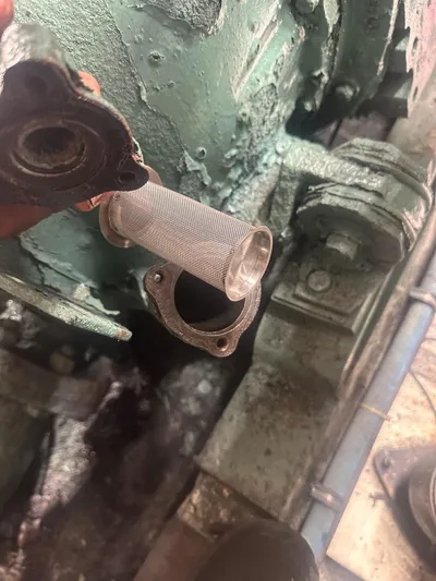  Yacht Photos Pics Engine component of a 1982 Bertram 46.6 War Wagon with a metal filter.