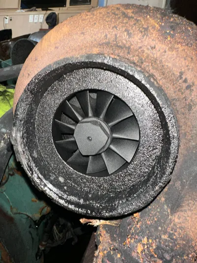  Yacht Photos Pics Rusty turbocharger of a 1982 Bertram 46.6 War Wagon boat engine.