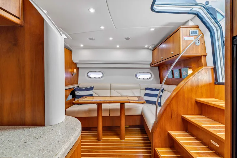  Yacht Photos Pics Luxurious interior of 2011 Tiara Yachts 4300 Sovran with elegant wood finish and cozy seating.