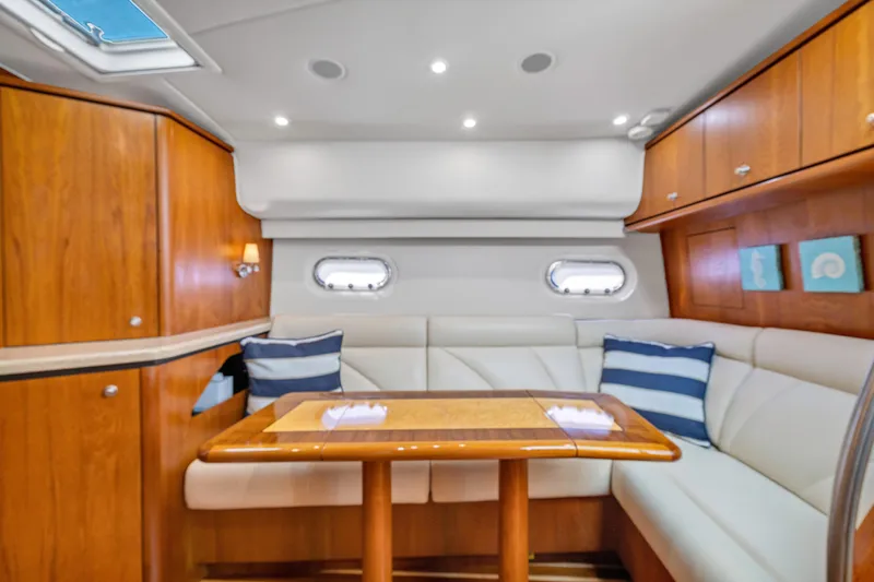  Yacht Photos Pics Luxurious interior of 2011 Tiara Yachts 4300 Sovran with elegant seating and wooden cabinetry.