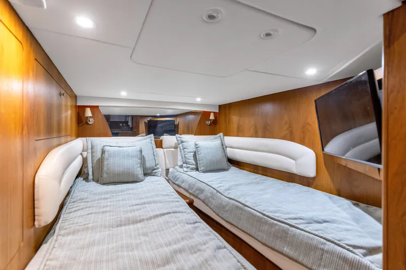 Yacht Photos Pics Luxurious cabin interior of 2011 Tiara Yachts 4300 Sovran with twin beds and modern amenities.