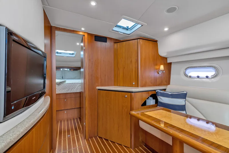  Yacht Photos Pics Luxurious interior of 2011 Tiara Yachts 4300 Sovran with wood finishes and modern amenities.