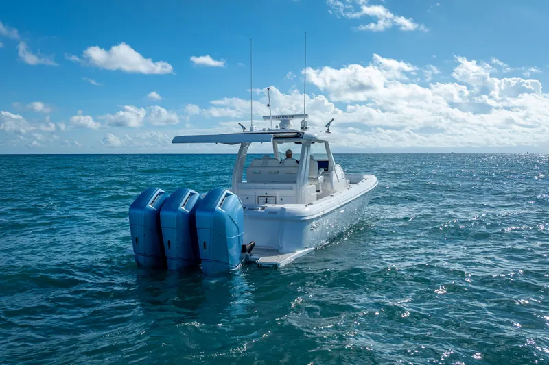  Yacht Photos Pics 2023 Intrepid 427 Nomad SE boat on open ocean under blue sky.
